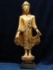 bouddha debout doré avec des miroirs